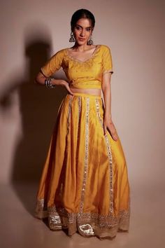 Mustard chanderi lehenga with embroidery work and gota borders. Comes with floral embroidered and teal organza dupatta with embroidery and border at all sides. - Aza Fashions Transitional Chanderi Lehenga With Gota Work, Semi-stitched Slub Silk Lehenga With Gota Work, Navratri Slub Silk Sets With Dori Work, Festive Gota Work Raw Silk Sets, Festival Slub Silk Lehenga With Zari Work, Transitional Chanderi Lehenga With Mirror Work, Traditional Drape Slub Silk Set With Gota Work, Yellow Raw Silk Set With Mirror Work, Tissue Silk Choli With Gota Work For Festivals