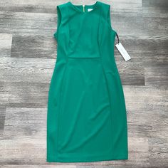 Nwt Size 6 Women's Green Scuba Crepe Sheath Dress By Calvin Klein - Green Midi Length Beautiful Dress For Formal Or Casual Style Wedding Guest Dress Gold Back Zipper Closure Smoke Free & Pet Free Home Ready To Ship Accepting Reasonable Offers Bundle Any Likes Pay 1 Shipping Fee Green Bodycon Sheath Dress, Fitted Green Dress With Back Zipper, Green Bodycon Mini Dress For Work, Calvin Klein Sheath Midi Dress For Work, Fitted Calvin Klein Bodycon Dress For Summer, Stretch Lined Dresses For Work, Calvin Klein Fitted Summer Bodycon Dress, Calvin Klein Knee-length Office Dresses, Calvin Klein Fitted Bodycon Dress For Summer