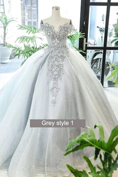 a dress on display in front of a window with the words grey style 1 written below it