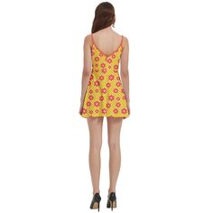 Yellow Orange Floral Dress: Eye-catching retro-inspired piece featuring a vibrant mod floral pattern in sunny yellow and bold orange hues Spaghetti Strap Mini Dress: Delicate straps offer a feminine touch, perfect for showcasing sun-kissed shoulders and embracing the 60s mod aesthetic Mod Floral Dress: Fun and lively 60s-inspired floral print captures the essence of mod fashion, making a playful statement wherever you go Retro Inspired Dress: Channels the spirit of 1960s fashion with a contempor 60s Mod Aesthetic, 60s Style Mini Dress, Dress 80s Style, Mod Aesthetic, 40s Style Dresses, 70s Fashion Dresses, 60s Fashion Dresses, Retro Inspired Dress, Orange Floral Dress