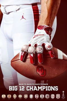 a man holding a football in his right hand with the number 10 on it's glove