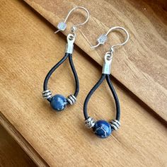 Blue Lapis beads are at the center of these teardrop leather earrings.  Enjoy these Nickel free silver plated earwires that are gentle on sensitive ears. - Genuine black leather - Lapis Beads - Silver spacers - Nickel free earwires - Lightweight, long wearing Find more of my earrings here: https://www.etsy.com/shop/fatcatbeads?section_id=42122010 Thank you for shopping with me! View all of my items here: www.fatcatbeads.etsy.com Everyday Blue Leather Jewelry, Elegant Blue Leather Jewelry, Elegant Teardrop Leather Jewelry, Elegant Dangle Jewelry For Everyday Use, Adjustable Nickel-free Minimalist Teardrop Earrings, Minimalist Adjustable Nickel-free Teardrop Earrings, Minimalist Nickel-free Adjustable Teardrop Earrings, Elegant Nickel-free Earrings For Everyday Use, Elegant Everyday Nickel-free Earrings