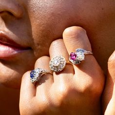 The Story A stunning ring from the 1930s-1950s, filled with sparkle and color. Meeting at the center and set askew are a gorgeous natural ruby and Old European cut diamond. The cushion-cut ruby weighs 1.44 carats, and the chunky old cut diamond weighs 1.15 carats. Working out from the center are four baguettes on top and bottom, giving the ring a chic geometric design. This incredible ring has a total diamond weight of approximately 1.61 carats. Done in platinum, the backs are open, allowing light to pour through, making the diamonds sparkle and the ruby pop with color. It would make a lovely engagement ring, but its unique look and style make it perfect for any occasion. A true heirloom piece. The Specs Style Number: R3555 Vintage, circa 1930s-1950s Platinum Old European Cut diamond weigh Platinum Ruby Ring With 17 Jewels, Classic Ruby Ring In Diamond White, Estate Platinum Rings, Ruby Ring In Platinum With Round Cut, Estate Platinum Rings With Center Stone, Round Cut Ruby Ring In Platinum, Platinum Ruby Ring With Round Cut, Platinum Ruby Ring With Round Cut Center Stone, Vintage Platinum Ring With Gemstone