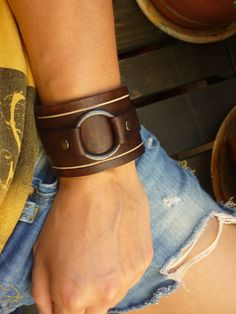 This bracelet is carefully crafted on 3mm brown vacchetta leather (0.12 in). The leather is very durable and can get wet without getting damaged or faded. PLEASE MEASURE YOUR WRIST FOR THE CLOSEST FIT. Metal snap button make it easy to put on and off. The width is 4,6cm (1,8 in). Simple but very urban feel. For more bracelets view here: https://www.etsy.com/shop/OUSI?section_id=18230067&ref=shopsection_leftnav_2 For more of my handmade leather goods, just click on the links below: Shop Home Brown Leather Bracelet With Wrist Strap, Modern Brown Leather Bracelet With Wrist Strap, Brown Leather Cuff Bracelet For Everyday, Everyday Brown Leather Cuff Bracelet, Leather Bangle Bracelet, Handmade Modern Brown Cuff Bracelet, Modern Handmade Brown Cuff Bracelet, Distressed Brown Leather Cuff Bracelet, Modern Brown Cuff Jewelry