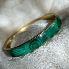 Stunning True-Vintage Malachite Bangle, One Of The Best Quality Bracelets I’ve Seen. This Is A Reluctant Sale, But My Wrists Are Just So Damn Tiny, I Can’t Justify Keeping It Hidden From The World Any Longer. Beautiful Worn Stacked With A Full Wrist, Or As A Stand-Alone Jewel Paired With A Minimalist Linen Outfit. Heavier, High Quality - 39 Grams - This Is Older And Much Nicer Than The Malachite Bracelets Seen In Recent Years. Selection On These Malachite Slabs Was Clearly A Very Careful Process On This Bracelet - Each Piece Nicely Cut, All Different Patterns Of Stone With Minimal Filler Inlay. Plenty Of Evil Eye Markings For Those Interested In The Traditional Properties. There Are Malachite Bracelets, Eye Markings, Singer Dr, Linen Outfit, Desired Reality, Malachite Bracelet, Brass Bangle, Stone Inlay, True Vintage