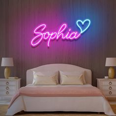 a bedroom with a bed, nightstands and a neon sign that says sophiia