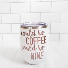 a white coffee mug with the words could be coffee could be wine printed on it