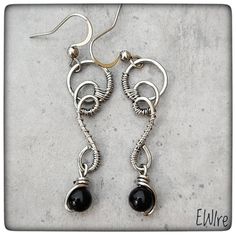 "The jewelry is delivered by Fedex, the delivery time is 3-4 working days! I bent these earrings from stainless steel wire. The wire type is 316L surgical metal wire. I decorated it with an 5-6 mm black onyx gemstone beads. The lever back closure is stainless steel, but not 316L. The high-gloss steel wire I use is a great alternative to silver wire.  It has a deeper gray color than silver.  However, this color is hereditary, does not change.  It does not oxidize, blacken, or discolor.  It gives a very stable jewelry shape.       Parameters: Total height appr.: 5 cm.(2\") I will send the jewel in bubble wrap or in a small box. You can find more earrings from me here: https://www.etsy.com/shop/EWirehu?ref=search_shop_redirect&section_id=28201898 Thank you for your visit!" Black Stainless Steel Jewelry For Jewelry Making, Wire Wrapped Metal Drop Earrings, Silver Dangle Wire Earrings, Unique Nickel-free Wire Earrings, Silver Wire Dangle Wrap Earrings, Silver Wire Wrap Dangle Earrings, Elegant Adjustable Wire Wrap Earrings, Pierced Dangle Earrings With Wire, Unique Black Stainless Steel Jewelry