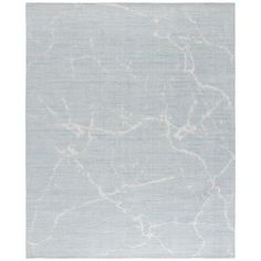 a blue and white rug with an abstract design