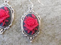 Beautiful cameo earrings!!!  Perfect gift!!!  Timeless classic look, both casual and formal!!  The cameo is set in a gorgeous tibetan silver setting, which measures about 1 1/2" x 1 1/4". The earring hooks are .925 stamped.  Quite a beautiful year round look!!!!  Thanks!!!  Lisa Silver Cameo Earrings As A Gift, Red Cameo Jewelry Gift, Formal Silver Earrings With Rose Design, Silver Earrings With Rose Design For Formal Events, Silver Rose Design Earrings For Formal Occasions, Cameo Earrings, Earring Hooks, Red Rose, Timeless Classic