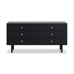 a black dresser with gold knobs on the top and bottom drawers, against a white background