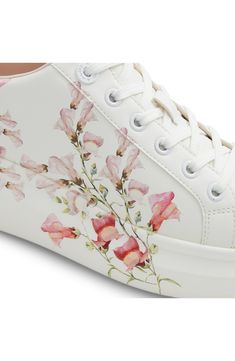 Dreamy watercolor flowers bloom across the midsole and sidewall of this romantic low-top platform sneaker cushioned by dual-density foam for all-day comfort. Cushioned footbed with arch support Pillow Walk™ comfort technology Synthetic upper/recycled-polyester textile lining/rubber and leather sole Imported Casual Low-top Floral Print Sneakers, Pink Lace-up Sneakers With Floral Print, Pink Floral Print Lace-up Sneakers, Pink Floral Print Sneakers With Round Toe, Spring Lace-up Platform Sneakers With Cushioned Footbed, Floral Print Textile Lace-up Sneakers, Floral Print Textile Sneakers For Spring, Spring Lace-up Platform Sneakers With Speckled Midsole, Spring Floral Print Sneakers With Round Toe