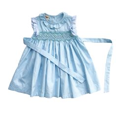 This lovely dress is made from cotton with beautiful blue sky color fabric and lace. It has intricate hand smocking with embroidered little flowers. Comfortable, perfect for everyday wear as well as formal occasion. *  100% cotton *  100% Handmade *  Tie at the back *  Lightweight, comfortable, and ready to play *  Hand wash or machine wash on a delicate setting We are based in Sydney, New South Wales, Australia. We always ship the dress out within 1 business day.  Within Australia, Standard shi Spring Smocked Dress With Lace Trim, Spring Cotton Dress With Smocked Back, Spring Cotton Dress With Smocked Bodice, Fitted Smocked Dress With Lace Trim For Summer, Sleeveless Smocked Dress With Lace Trim For Spring, Spring Cotton Smocked Dress With Ruffles, Elegant Smocked Dress With Lace Trim For Spring, Blue Cotton Smocked Sundress, Cotton Smocked Dress For Spring Garden Party