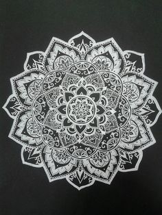 a black and white drawing of a flower