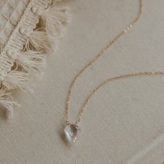 *Stone is attached to 18" of our delicate cable chain. *Handmade in Eau Claire, WI. Our jewelry is handmade so each piece will be unique and may vary slightly from what is pictured. Delicate Gemstone Necklaces For Everyday, Delicate Everyday Gemstone Necklaces, Delicate Everyday Crystal Necklace With Delicate Chain, Delicate Everyday Gemstone Necklace, Delicate 14k Gold Filled Briolette Necklace, Sterling Silver Crystal Necklaces With Adjustable Chain For Everyday, Minimalist Teardrop Crystal Necklaces For Jewelry Making, Teardrop Crystal Necklace With Delicate Chain For Gift, Dainty Faceted Necklaces For Gifts