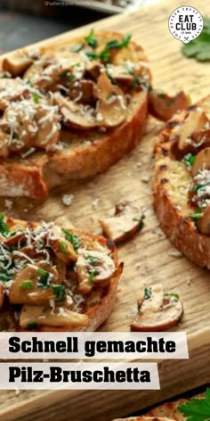 several pieces of bread topped with mushrooms and parmesan cheese on a cutting board