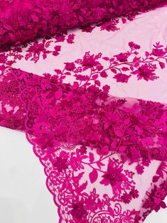 three pieces of pink lace with flowers and leaves on the edge, all in different colors