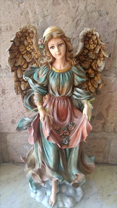 a statue of an angel with wings