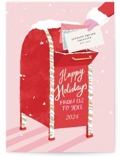 a red mailbox with a sign that says happy holidays from us to you