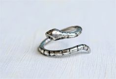 These little guys are so cute, I create these snakes from 10 gauge round wire. THey're oxidized as shown, and each one is slightly different, due to their hand carved nature, making each on unique. Unique Hand Forged Snake Ring, Unique Hand Forged Snake Ring As Gift, Unique Hand Cast Snake Ring Gift, Unique Hand Cast Snake Ring As Gift, Handmade Adjustable Snake Shape Rings, Adjustable Spiral Snake Ring As Gift, Handmade Adjustable Snake Ring As Gift, Handmade Snake Shaped Ring As Gift, Adjustable Unique Snake Ring