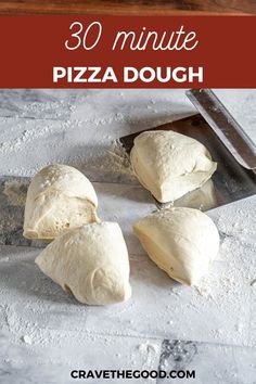 four pieces of pizza dough sitting on top of a cutting board