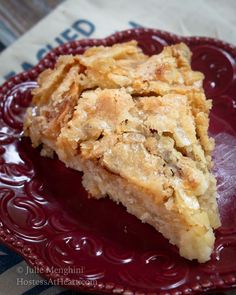 a piece of pie sitting on top of a red plate