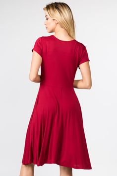 Cocktails? Date night? Sunday brunch? Cover all your upcoming events with this sexy surplice short sleeve dress! Featuring soft stretchy fabric, a faux wrap-around style bodice, a flowy high empire waist silhouette, and an above the knee hem makes this dress perfect for any occasion. Surplice front V-neckline Short sleeves Faux-wrap front bodice Flowy A-line dress Soft and stretchy Comfortable material Above the knee hem 95% Polyester, 5% Spandex Imported Model StatsMODEL: Color - NavyHEIGHT: 5' Flirty Fitted V-neck Wrap Dress, Fitted V-neck Plain Midi Dress, Fitted V-neck Solid Color Dress, Fitted V-neck Solid Color Midi Dress, Fitted Solid Color V-neck Dress, Fitted V-neck Solid Midi Dress, Flirty Fitted Dress With Surplice Neckline, Fitted Solid Color Dress With Short Sleeves, Solid Color Stretch Mini Dress With Short Sleeves