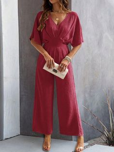 This Sangria Sway Wide Leg Jumpsuit is the perfect combination of comfort and style. With its flowy design and wide leg silhouette, you can sway and dance all night long. A must-have for any fashion-forward individual looking to make a statement. (No need to sacrifice style for comfort with this jumpsuit!) Size Guide: Model is 5’85” tall, and has a 34.2” bust, 24.1” waist, & 35.8” hips. She is wearing a S / US 4 / AU 8. This jumpsuit is true to size. Material: 100% Polyester. Feature: V-Neckline. Short cap sleeves. Fitted waist. Wide leg. Open V-back. Not lined. Side invisible zipper closure. Relaxed fit. Care Instructions: Machine wash / Cold hand wash