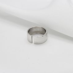 Dimensions Ring width: 8mm Wide wedding ring in 925 sterling silver. Excellent wide slotted ring that allows you to adjust it exactly to your finger size. This ring can be used both as an engagement ring and for every day. Silver plated with rhodium, this protects the ring from wear and gives it a shine. Rhodium is harmless to the skin. Wedding Ring Wide Band - Sterling Silver Band Ring - Statement Ring - Open Band Ring - 925 Silver Wide Band Ring - Gift For Her - Minimalist Minimalist Sterling Silver Wide Band Ring In White Gold, Minimalist White Gold Wide Band Ring In Sterling Silver, Minimalist White Gold Sterling Silver Wide Band Ring, Minimalist Sterling Silver Wide Band Ring For Anniversary, Minimalist Wide Band Open Ring With Polished Finish, White Gold Wide Band Open Ring, White Gold Open Band Promise Ring, Silver Minimalist Wide Band Ring For Anniversary, Minimalist Silver Wide Band Ring For Anniversary