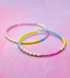 A revisit to my Neon Dreams collection, this time in a fun summertime hoop. Neon pink, yellow and blue with gold and white accents, these cuties exude effortless cool. Fun, bright and perfect for daily wear. Hand-beaded using high-quality Miyuki Delica beads on gold-filled hoops. 30mm, 1.18 in diameter. To ensure longevity of your beaded beauties, always store flat or hung. Fun Gold Jewelry For Summer, Fun Gold Summer Jewelry, Gold Hoop Earrings With Tiny Beads For Summer, Summer Hoop Jewelry With Tiny Beads, Trendy Summer Hoop Earrings With Tiny Beads For Beach, Summer Beach Hoop Earrings With Tiny Beads, Colorful Summer Jewelry With Letter Beads, Playful Everyday Summer Jewelry, Pink Tiny Beads Jewelry For Spring