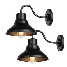 two black wall lights with one light on each side and the other turned on in different directions