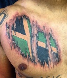 a man with tattoos on his chest has a flag painted on the chest and is holding a cell phone