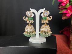 Jadau Kundan AD Moissanite Elephant Jhumka Earrings/ 3 Inches Long/wide 1.3 Inch/Kundan Green Stone/Mint  Green Beads Pearl Drop/Gold Finish These fabulous Earrings are high-quality and will match with a number of outfits. Wear them for any occasion, or give them as a gift.  DETAILS: Includes Two Earrings only. Length: 3.0 Inches Long  wide ; 1 i.3 Inch Wide  Weight for Earring Set: 2.10 oz ( 60 g) Earring backs Push to on/off.  Material: Imitation gold Finish/ Pachi Kundan green, AD Moissanite Green Chandbalis For Diwali Reception, Green Chandbalis For Reception And Diwali, Green Tilla Jhumkas For Reception, Green Chandbalis For Reception And Festivals, Green Festive Jhumkas For Ceremonial Occasions, Green Festive Ceremonial Jhumkas, Festive Green Ceremonial Jhumkas, Festive Ceremonial Green Jhumkas, Hand-set Jhumkas For Reception And Festivals