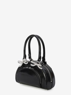 Check out this sleek mini tote bag—it's got that chic black leather vibe with a touch of sparkle from its diamanté bows. Perfect for carrying your essentials in style, it's got enough pockets and compartments to keep everything neat and tidy. It's like your new go-to buddy for both classy events and quick coffee runs. Fixed double handles for easy carrying Exterior front two-way zip pocket Exterior rear flat pocket for extra space Main two-way zip closure Main interior compartment with card slot Black Satchel With Round Handles, Black Trendy Satchel With Round Handle, Trendy Black Satchel With Round Handle, Black Bag With Round Handles, Black Party Bag With Round Handle, Evening Black Satchel With Zipper Closure, Black Shoulder Bag With Round Handle For Evening, Tote Design, Quick Coffee