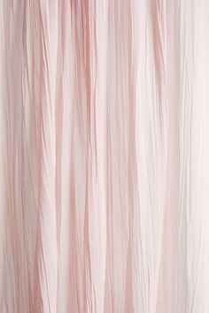 the curtain is pink and white in color