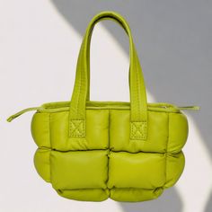 Add a vibrant pop of color to your everyday look with MUIR LONDON's Mini Limelight, a petite crossbody crafted from pure, buttery leather. This eye-catching bag boasts a statement-making lime green hue that's sure to turn heads, all in a compact size perfect for on-the-go essentials. Small but mighty in style and function: Premium Leather: Experience unparalleled quality and a soft, luxurious feel that elevates any outfit. Dimensions (12x18x07cm): This crossbody offers just the right amount of s Green Quilted Bag For Travel, Everyday Green Quilted Bag, Green Quilted Square Bag, Trendy Green Quilted Shoulder Bag, Square Green Quilted Bag, Green Quilted Bag For Daily Use, Green Quilted Shopping Bag, Green Quilted Rectangular Bag, Green Square Bag With Zipper Closure