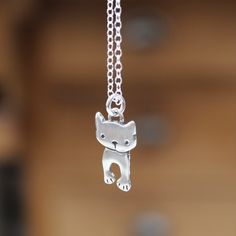 This tiny little dancing cat charm measures 3/4 of an inch tall. It can be ordered as a charm "charm only" or as a necklace on an adjustable sterling silver chain.The chain can be latched on any link between 16 and 20 inches. Cute Silver Charm Necklaces With Lobster Clasp, Cute Hypoallergenic Silver Charm Necklaces, Cute Silver Charm Necklaces, Cute Nickel-free Silver Charm Necklace, Cute Silver Nickel-free Charm Necklaces, Cute Silver Nickel-free Charm Necklace, Cute Hypoallergenic Sterling Silver Necklaces, Cute Hypoallergenic Sterling Silver Necklace, Adjustable Delicate Sterling Silver Charm Necklace