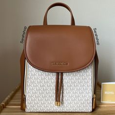 100% Authentic Brand New With Tags Phoebe Md Flap Drawstring Backpack Vanilla And Gold Hardware Approximate Measurements: 11.5" L X 13" H X 5” D Adjustable Strap Jelly Purse, Studded Backpack, Michael Kors Backpack, Book Bags, Medium Backpack, Bags Michael Kors, Blue Backpack, Cute Bags, Backpack Purse