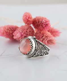 Pink Chalcedony Silver Floral Boho Statement Ring 925 Sterling Artisan Made Jewelry Handcrafted Filigree Genuine Gemstone Cocktail Ring, Handmade rings jewelry Material: 925 Sterling Silver ( NICKEL FREE ) Gemstone: Pink Chalcedony 12 mm. FREE, FAST AND TRACKABLE SHIPPING FOR ALL EU COUNTRIES AND USA. -That ring is so stunning and dainty. Perfect for everyday wear. There is a gorgeous small Flower on the band of the ring and Chalcedony Gemstone that dainty. This pink stone ring is made from our Traditional Silver Jewelry With Gemstone Accents, Bohemian Wedding Rings With Gemstone Accents, Elegant Pink Moonstone Sterling Silver Ring, Bohemian Sterling Silver Jewelry With Accent Stones, Bohemian Pink Wedding Rings, Bohemian Silver Rings With Accent Stones, Bohemian Rings With Gemstone Accents For Anniversary, Bohemian Anniversary Rings With Gemstone Accents, Spiritual Filigree Ring Gift