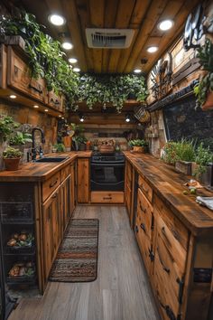 a kitchen filled with wooden cabinets and lots of plants