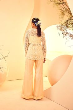 Featuring a pearlwork hand-embroidered jacket with flared pants. It comes with a bralet From Aneesh Agarwaal's Naksh collection. DELIVERY TIMEPlease allow 8-12 weeks for your outfit to arrive. FABRIC DETAILSPants, Satin Organza, Jacket-Tulle Professional cleaning only. Elegant Fitted Palazzo Set With Pearl Embroidery, Glamorous Sets With Intricate Embroidery For Eid, Glamorous Evening Sharara With Pearl Embroidery, Embellished Fitted Pant Set With Long Sleeves, Fitted Long Sleeve Embellished Pant Set, Fitted Embellished Long Sleeve Pant Set, Glamorous Floral Embroidered Sets For Reception, Glamorous Sets With Floral Embroidery For Reception, Embroidered Fitted Palazzo Set For Evening