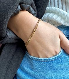 "10K Yellow Gold Figaro Chain Bracelet, 10K Real Gold Bracelet Figaro Link Bracelet, 10K Gold 7\"Inch/4.7mm Thick Lightweight Hollow Bracelet, Women Bracelet, Gift for Her Immerse yourself in the timeless allure of the 10K Yellow Gold Figaro Chain Bracelet. Crafted with meticulous attention, this bracelet boasts a refined 4.7mm width and a comfortable 7-inch length, striking the perfect balance between sophistication and everyday wearability. The classic Figaro chain design, characterized by its Real Gold Bracelet, Gold Figaro Chain, Figaro Bracelet, Gold Link Chain, Link Chain Bracelet, Jewelry Accessories Ideas, Gold Bracelet For Women, Women Bracelet, Wedding Jewelry Bracelets