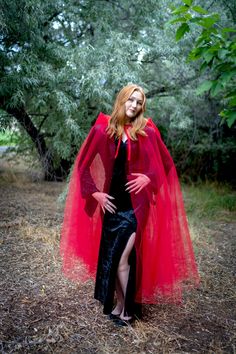 This Red Tulle Adult Cloak is perfect for a variety of dress up occasions; wear to any Halloween Party, Cosplay, Role Playing, Gothic, Steampunk, Renaissance, Medieval Events or a Masquerade Ball! Made from two layers of red tulle, measuring from 50" from neckline to hem Oversized, gathered tulle hood with a satin tie closure One size fits most adults and teens Machine washable and made for repeat use Costumes & accessories not included Vampire Costume For Halloween Themed Events, Fitted Red Cosplay Costume For Party, Fitted Red Cosplay Costume For Halloween, Red Fitted Cosplay Costume For Halloween, Red Cosplay Costume For Parties And Events, Red Cosplay Costume For Events, Red Cosplay Costume For Cosplay Events, Red Fitted Cosplay Costume For Themed Events, Red Costume For Cosplay Party