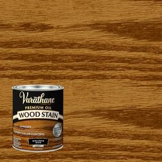 a can of wood stain sitting on top of a wooden table