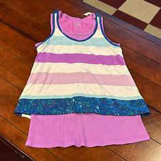 Nwt Justice Retail Store Layered Striped Tank Sequins Purple Blue Size 18 This Is A Double Tank Layered Look. The Striped Tank Is Attached To The Ribbed Tank Top Underneath. Blue Summer Sleepover Top, Purple Sleeveless Top For Playwear, Sleeveless Purple Tops For Playwear, Playful Fitted Purple Tops, Blue Spring Top For Sleepover, Multicolor Stretch Tops For Playwear, Stretch Multicolor Tops For Playwear, Blue Tank Top For Spring Playwear, Fitted Blue Tops For Sleepover