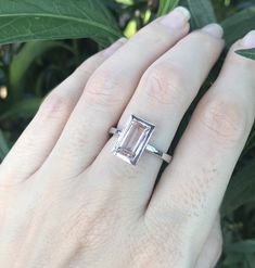 "A stunning north south setting featuring a rectangle shaped genuine flawless Morganite from Brazil is bezel set with a polish finish makes a lovely engagement/promise/statement ring. Wrapped in a box ready for gift-giving. Morganite measure 9.5mm x 6mm ---> Don't know your ring size? Purchase our ring sizing gauge https://www.etsy.com/listing/290720637/ring-sizer-ring-sizing-gauge-multisizer?ga_search_query=ring+sizer&ref=shop_items_search_1 *Follow us @belesasjewelry on Instagram for pr Anniversary Emerald Ring With Bezel Setting, Classic Emerald Ring With Rectangular Bezel Setting, Rectangular Emerald Ring In Sterling Silver For Wedding, Classic Rectangular Emerald Ring With Bezel Setting, Rectangular Sterling Silver Emerald Ring For Wedding, Timeless Rectangular Emerald Wedding Ring, Classic Square Cut Ring With Bezel Setting, Formal Emerald Ring With Rectangular Stone And Bezel Setting, Rectangular Solitaire Wedding Jewelry