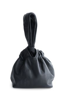 Our best selling Mariposa Bucket bag features the softest Italian lambskin. The supple leather, gives the bag a beautiful chic ruched look at the top where it gathers for closer. The leather handle allows for easy grip and holding it on-the-go. This bag is the perfect bag to take for brunch with friends, shopping or for a fun night out in the city. Friends Shopping, Black Camel, Perfect Bag, Clutch Handbag, Leather Handle, Minimalist Design, Bucket Bag, Metallic Silver, Camel