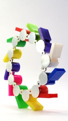 Functional Whistles to wear as a bracelet. A unique limited edition collectors item from the Musical Jewelry collection. This up cycled Pop Art piece is fun and colorful, unique and fresh. German Silver and Silver Plated with plastic, Size: 12cmX12cmX1.6cm You can see more musical jewelry here: https://www.etsy.com/shop/ShirazelohevJewelry?section_id=17380976&ref=shopsection_leftnav_4 Musical Bracelet, Pop Art Jewelry, Musical Jewelry, Nose Hoop, Plastic Jewelry, German Silver, Statement Bracelet, Delicate Rings, Bracelet Silver