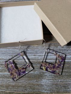 Beautiful and natural, geometric inspired earrings with large resin squared diamonds. Real flower earrings preserved in resin squares, with tiger lily flower and purple bell flower. Gorgeous natural flower petal earrings, boldly colorful, and preserved for eternal beauty ♥ Be sure to check out the PURPLE EARRINGS section at EarringsbyLCreations for all beautiful purple colored earrings available! https://www.etsy.com/shop/EarringsByLCreations?section_id=28420997 Made with quality materials and a Modern Square Pendant Earrings For Gift, Modern Square Pendant Earrings As Gift, Gift Earrings With Square Pendant For Pierced Ears, Gift Square Pendant Earrings For Pierced Ears, Square Pendant Earrings For Gift, Square Hypoallergenic Earrings For Gift, Hypoallergenic Square Earrings For Gifting, Hypoallergenic Square Earrings As Gift, Hypoallergenic Square Earrings For Gifts