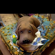 a chocolate dog cake sitting on top of a table